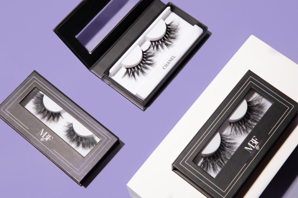 Close-up of eye with professionally applied lash extensions showing perfect lash length and curl tailored to enhance specific eye shape for choosing the right eyelash extension style.